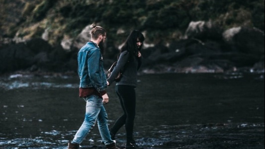 Couple Walking Together by a River